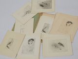 a lot of drawings of people on a table
