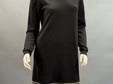 a mannequin dress with black and gold stripes on a mannequin mannequin mannequin mannequin mannequin mannequin manne