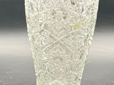 a glass vase that is sitting on a table