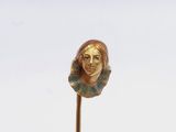 a statue of a woman with a flower on top of a stick