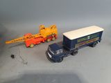 a toy truck with a crane on the back of it