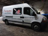 a white van that is parked inside of a building