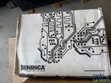 a cardboard box with a printed circuit board on it