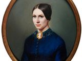 portrait of a woman in a blue dress in a gold frame