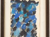 a painting of blue flowers in a brown frame on a white wall