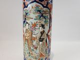 a vase that has a picture of a woman on it