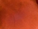 a close up of a person ' s stomach with a red substance on it