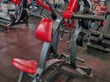 a gym with a lot of machines in the room