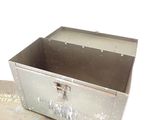 a metal box with a lock on it sitting on the floor