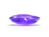 a close up view of a purple amethorate stone on a white background