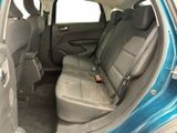 a blue car that is sitting in the back of the car