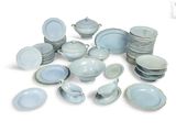a pile of blue and white plates and bowls