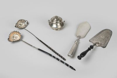 four different types of kitchen utensils on a white surface