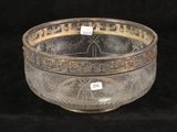 a glass bowl that is sitting on a black surface