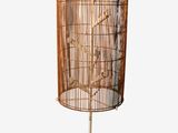an image of a bird cage on a stand on a white background