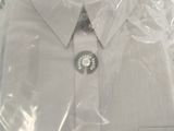 a white dress shirt wrapped in plastic on a table