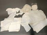 several pieces of clothing are laid out on a table