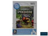 the wii game pikmine is on display in a white box