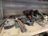 many tools on a workbench in a garage