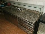 an image of a kitchen with granite counter tops and stainless steel appliances