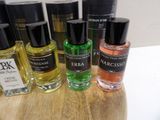 bottles of perfume sitting on top of a wooden table next to each other