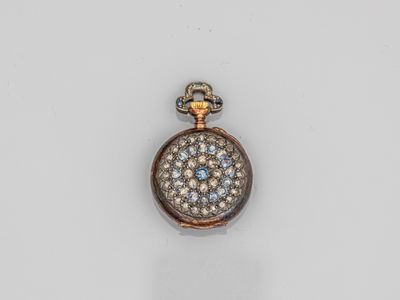 a gold and diamond pocket watch