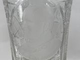 a glass vase with a picture of a man on it
