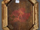 painting of a red flower in a wooden frame on a gray surface