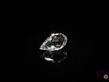a close up of a diamond on a black surface