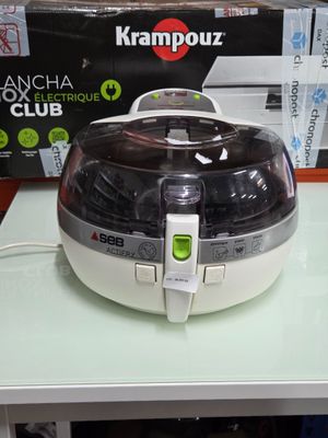 an image of a white and black air fryer on a table