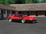 a red sports car parked in front of a motel