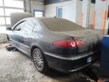 a car that is sitting in a garage with the door open
