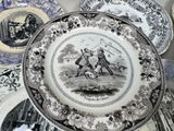 a lot of plates that are sitting on a table