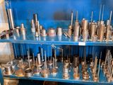 a blue shelf that has many different tools on it