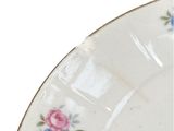 a close up of a plate with flowers on it