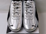 a close up of a pair of silver shoes on a box