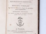 an open book with a picture of a man holding a sword