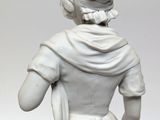 a white statue of a woman with a scarf on her head