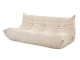 un canapé-futon blanc posé sur un sol blanc