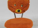 an orange chair with a cat face on it