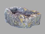 a stone bowl with moss growing out of it