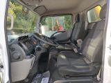a white van with black seats and a steering wheel