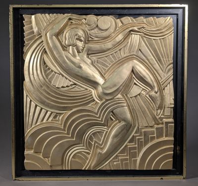 an art deco sculpture of a woman holding a surfboard