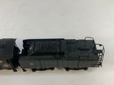 the toy train is black and has a black caboose on it