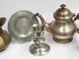 five different types of silverware on a white surface