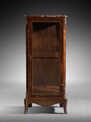 an old wooden cabinet with a glass door on a stand