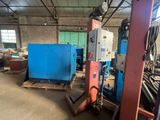 two machines that are sitting in a building