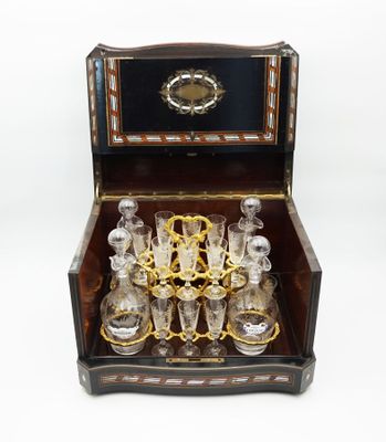 a wooden box with a set of glasses in it