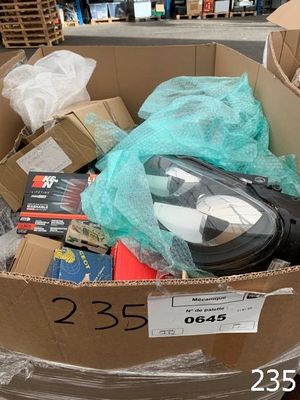 a cardboard box filled with assorted items in a store