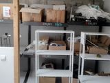 many boxes and boxes on the shelves in the room